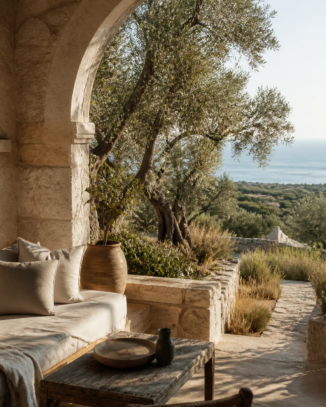 A generous table arranged beneath Mediterranean trees